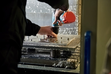Worker is using a screwdriver. Preparation for unscrewing.