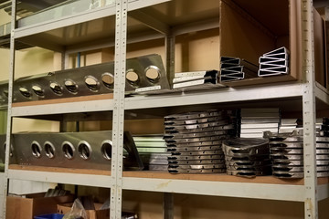 Obraz na płótnie Canvas Aluminum details on shelves. New metal parts.