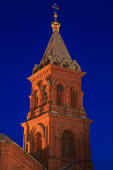 Brick built Uspenski orthodox cathedral in Helsinki illuminated in the night, Finland