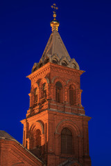 Obraz premium Brick built Uspenski orthodox cathedral in Helsinki illuminated in the night, Finland