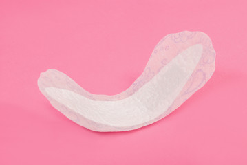 Woman daily pad hygiene protection isolated on pink background