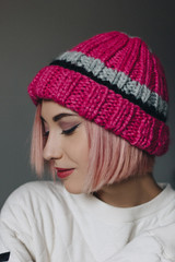 Girl in pink knitted hat