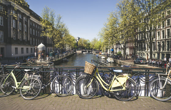 Bikes on the bridge in  Amsterdam, Netherlands. Canals of Amsterdam.