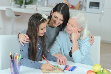 granny her daughter and granddaughter are drawing