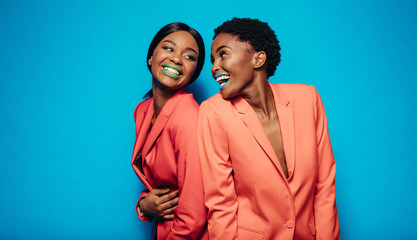 Laughing young women in stylish clothing