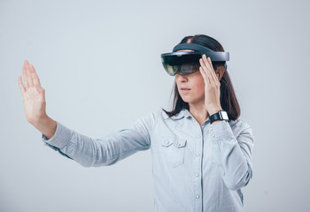 Woman wearing augmented reality goggles.