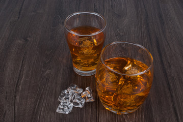 two whisky on the rock on wood and wood background