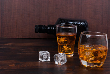 two whisky on the rock on wood and wood background