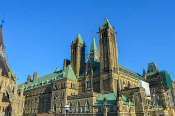 The back view of The Center Block and the Peace Tower in Parliament Hill, Ottawa, Canada. Center Block is home to the Parliament of Canada. 