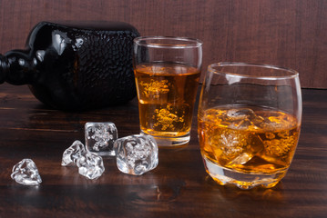 two whisky on the rock on wood and wood background