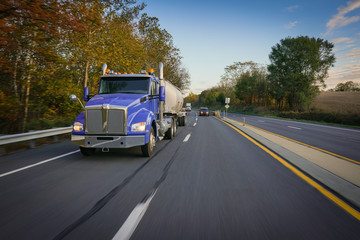 Fototapeta na wymiar Fuel tanker truck 18 wheeler on highway
