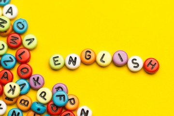 English word composed from colorful abc alphabet block wooden letters, copy space for ad text. Education concept.