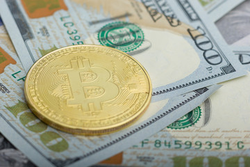 Bitcoin golden coin New virtual money and dollar background . Cryptocurrency. Business and Trading concept. Close-up shot