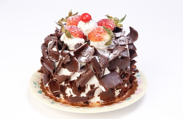 Chocolate cake with strawberries on white background 