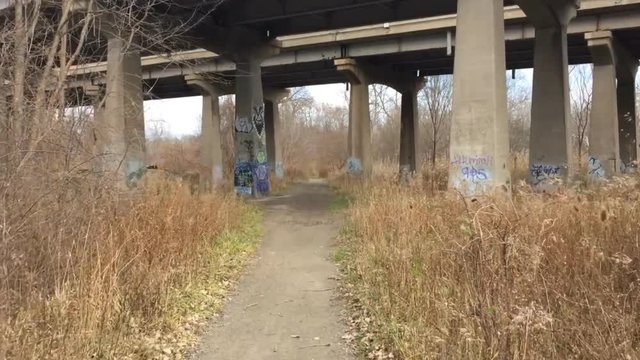 Homeless and lonely shelter under bridge in city