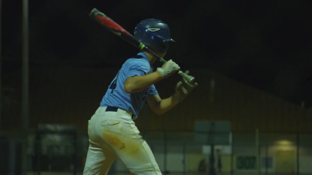 Slow motion of batter at bat not hitting the ball during baseball game