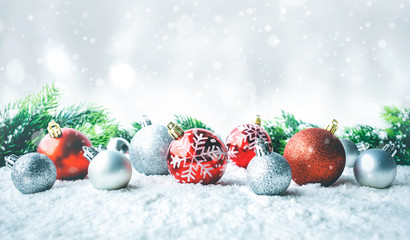 Fototapeta na wymiar Christmas ball (ornament) on snow background.For christmas concepts or new year,celebration ideas.