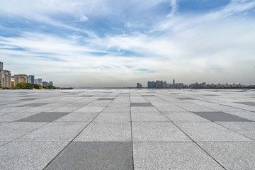 Panoramic skyline and buildings with empty square floor.