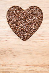 Raw flax seeds linseed heart shaped