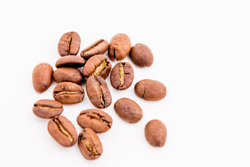 Roasted coffee beans on wood texture background.