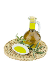 Olive oil Bottle and bowl plate with olive branch. Virgin olive oil. Natural olive oil, healthy food. Natural mediterranean food. Bread dipping.