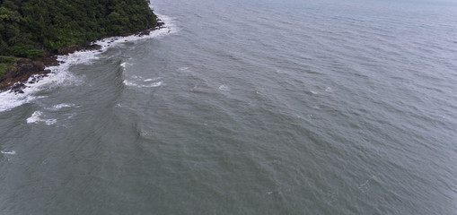 The Sea Crashing Into The Side of an Island