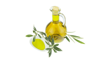 Olive oil Bottle and bowl plate with olive branch. Virgin olive oil. Natural olive oil, healthy food. Natural mediterranean food. Bread dipping.