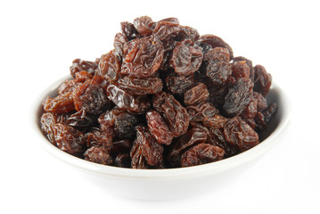 Black raisins on a white background         