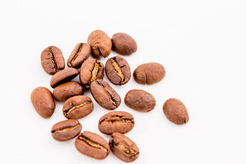 Roasted coffee beans on wood texture background.