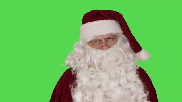 Santa Claus Frowning at Naughty List (Green Screen)