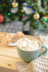 Big cup of coffee with marshmallow on the wooden box