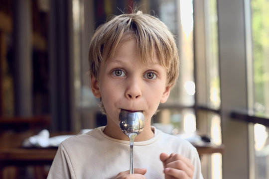 Boy Licking Spoon