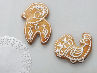 Culinary background. Homemade Christmas sugar cookies glazed with royal icing. Christmas biscuits in the shape of animals. Selective focus.