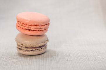 Delicious cake macaroons on light background, close up