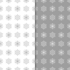 Snowflakes patterns. Set of gray seamless backgrounds with christmas elements