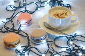 Macaroon cake and Christmas garland, close up