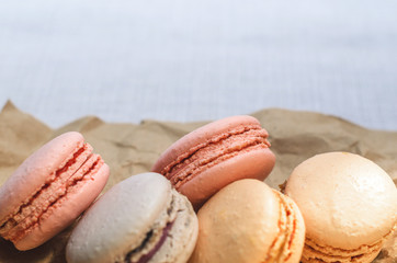 Fototapeta na wymiar Appetizing cakes macaroons in the package close up