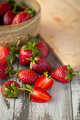 Strawberry In a bowl On a Wooden Background