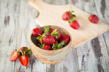 Strawberry In a bowl On a Wooden Background