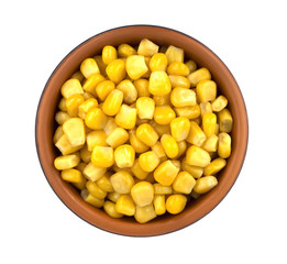 Sweet corn kernels in bowl over white