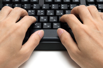 Hands using keyboard on white background