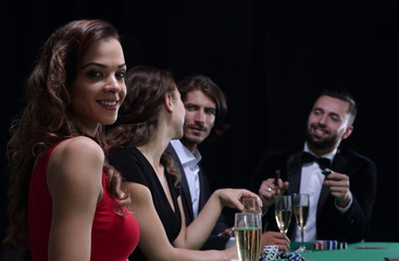 adult group celebrating friend winning blackjack