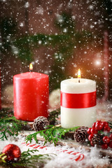 Christmas card with burning candles and decorations