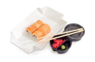 Sushi with salmon in box for take-out food, condiments