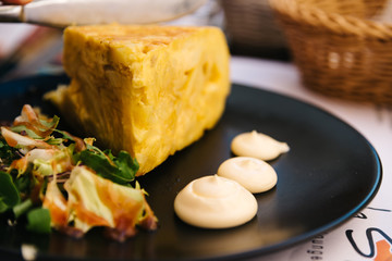 Spanish omelette with mayonnaise in restaurant