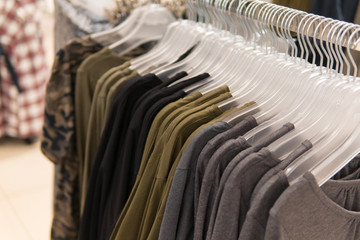 Men clothes, row of t-shirt collection, shopping