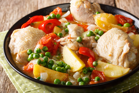 Filipino Afritada: slices of chicken with vegetables close-up in a bowl. horizontal