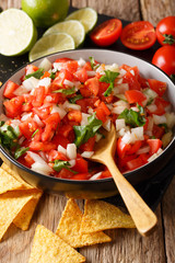Mexican food: Pico de Gallo close-up in a bowl. vertical