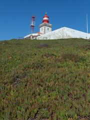 Fototapeta na wymiar White Lighthouse in Cabo da Roca, Sintra, Portugal