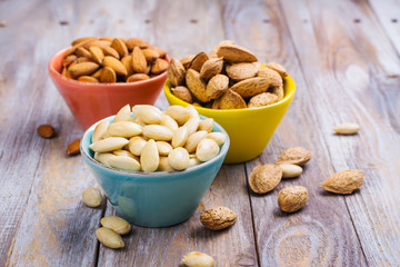 Assortment of almond nuts - peeled and fried, unpeeled and almonds in shells